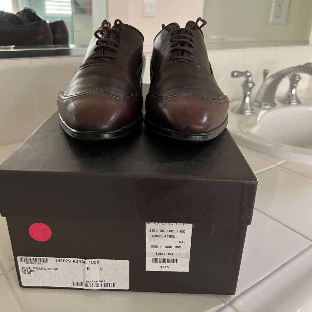 Gucci rubber sole oxfords in brown.